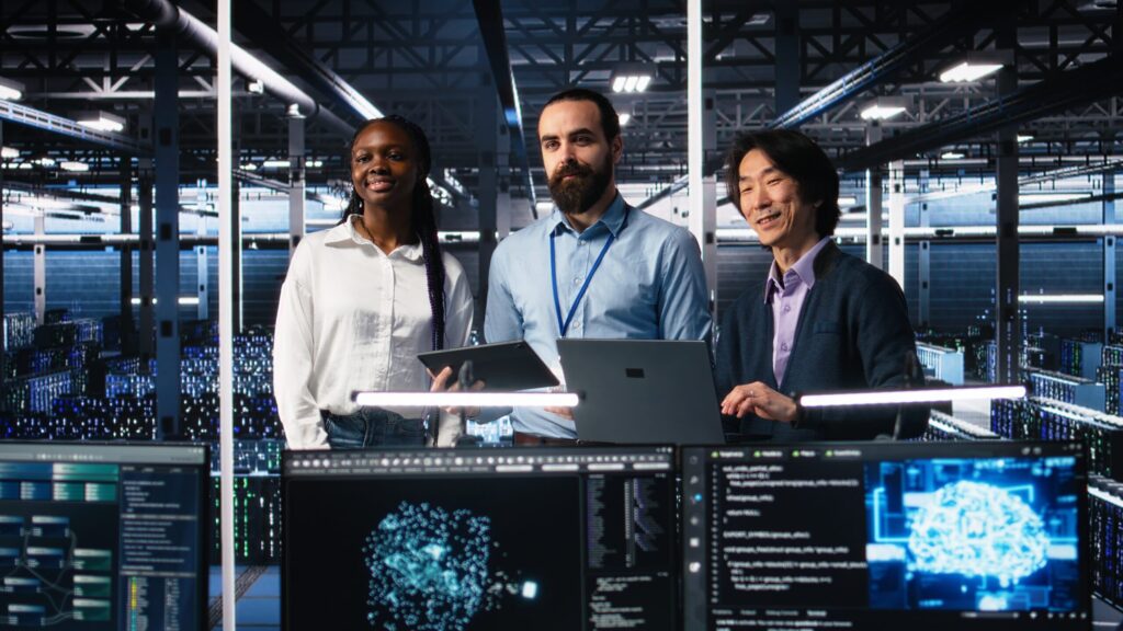 happy data center colleagues collaborating on software development