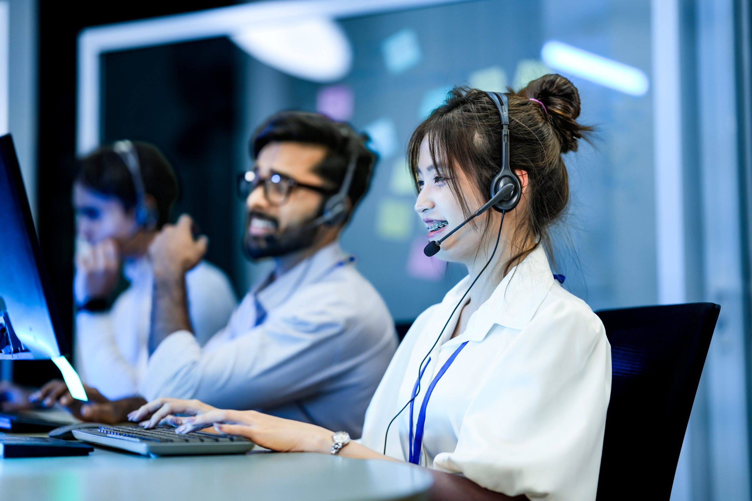 a diverse team of technical support specialists works a late shi